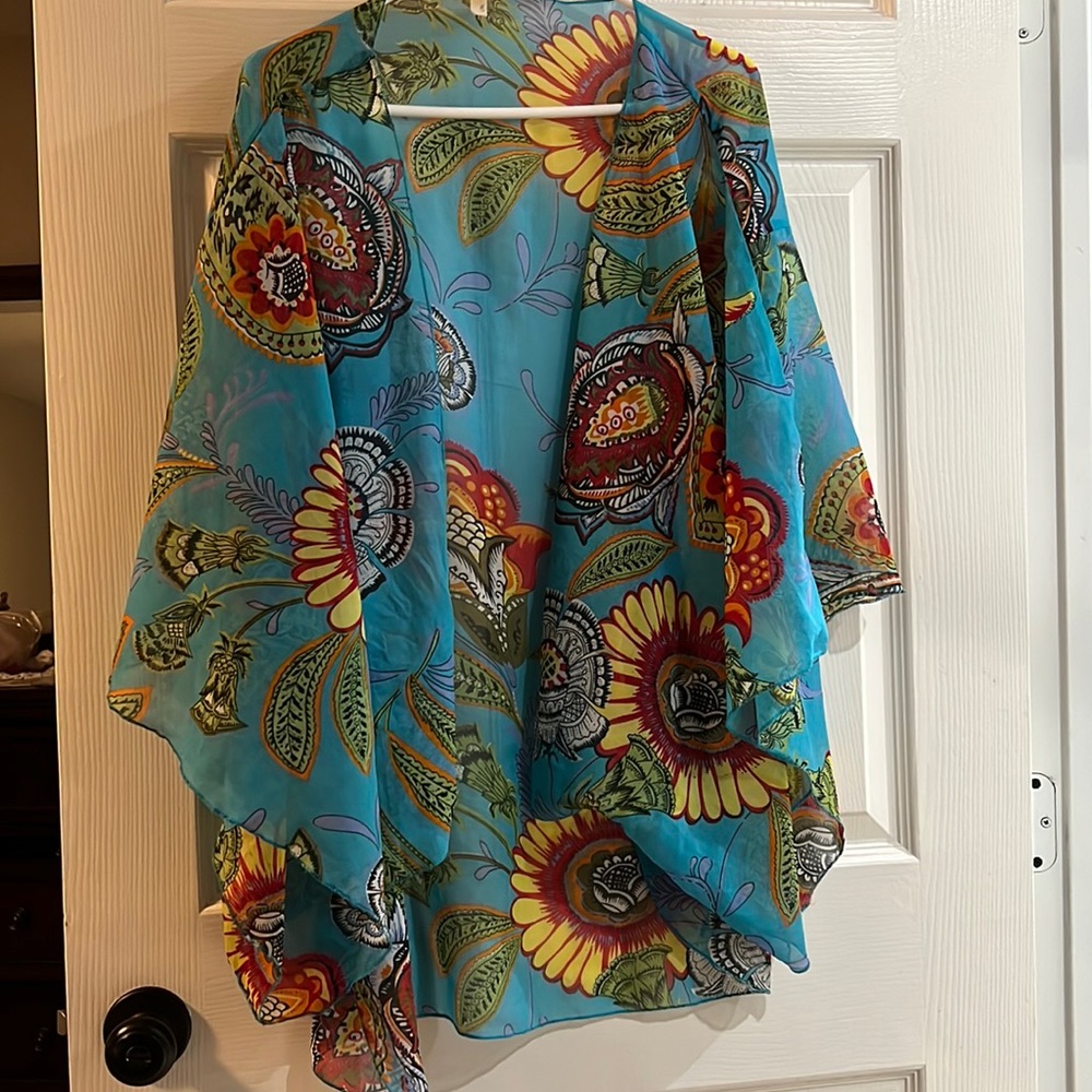 Almost new, open tunic